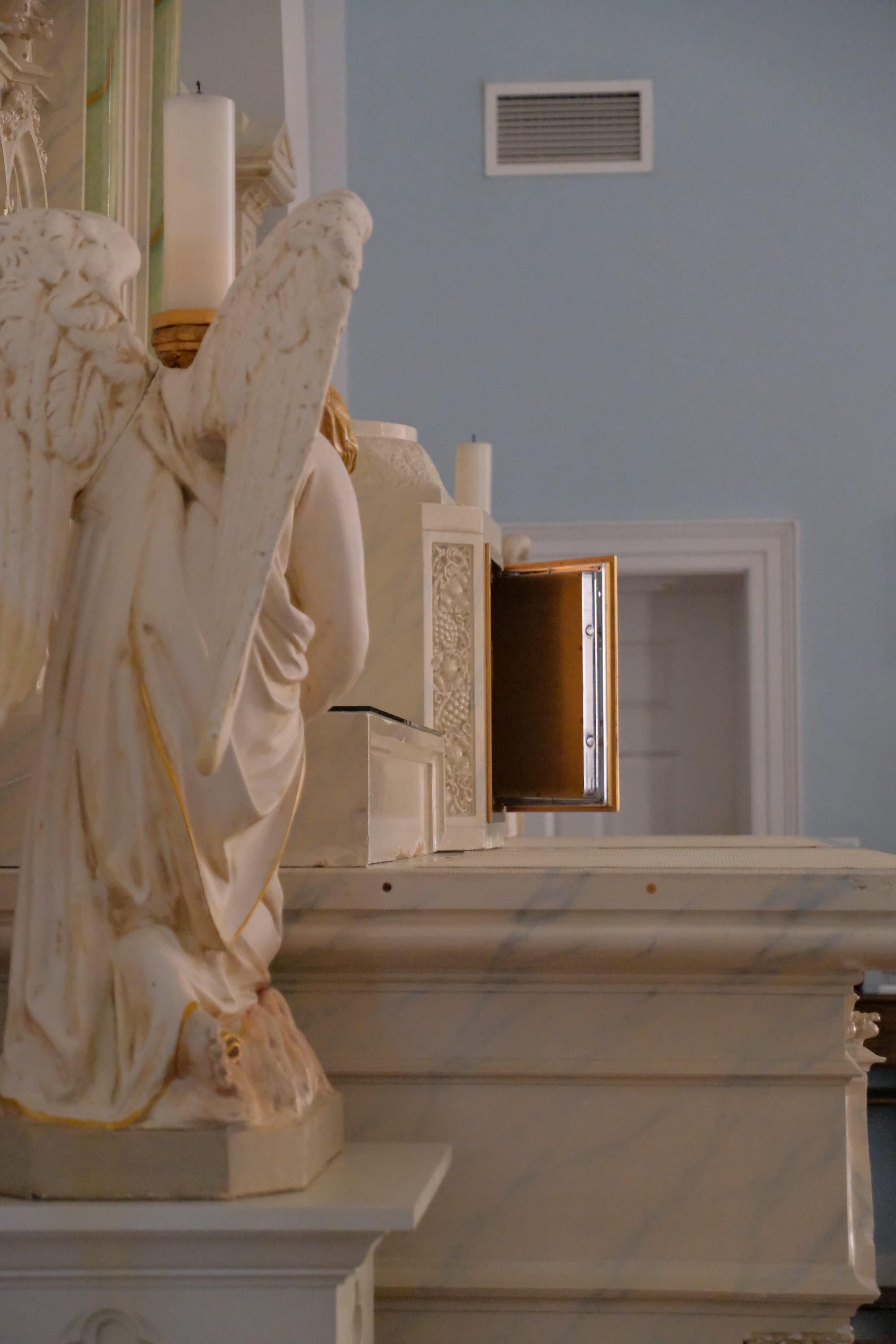 Angel Statue and Empty Tabernacle on Good Friday (Saint Benedict's Church, Chesapeake, Virginia, 2024) - Catholic Stock Photo by Shalone Cason