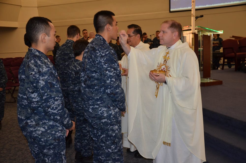 Bishop Coyle Gives Holy Communion to Navy Recruits (2014)