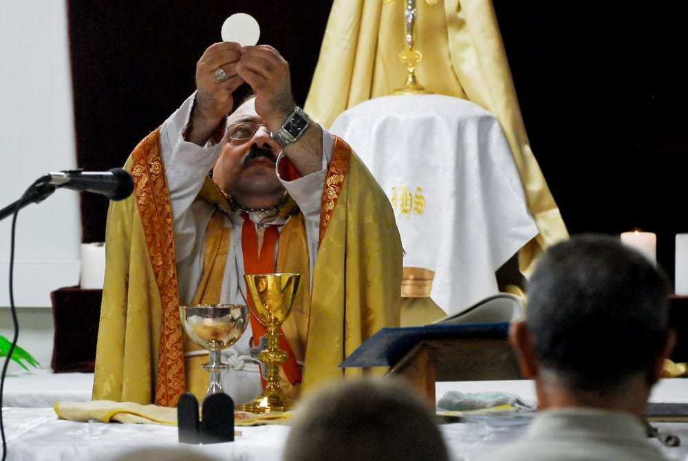 Iraqi Bishop Raises the Host at a Mass for U.S. Troops in Basra (2009)