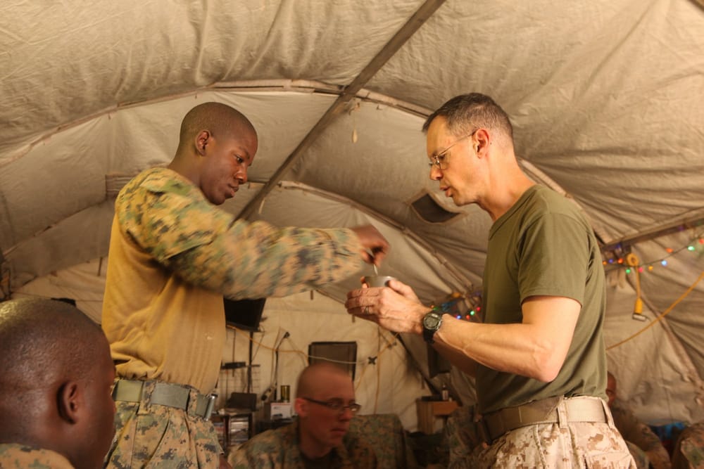 Marine Receives Holy Communion at Patrol Base Garret in Marjah (2012)