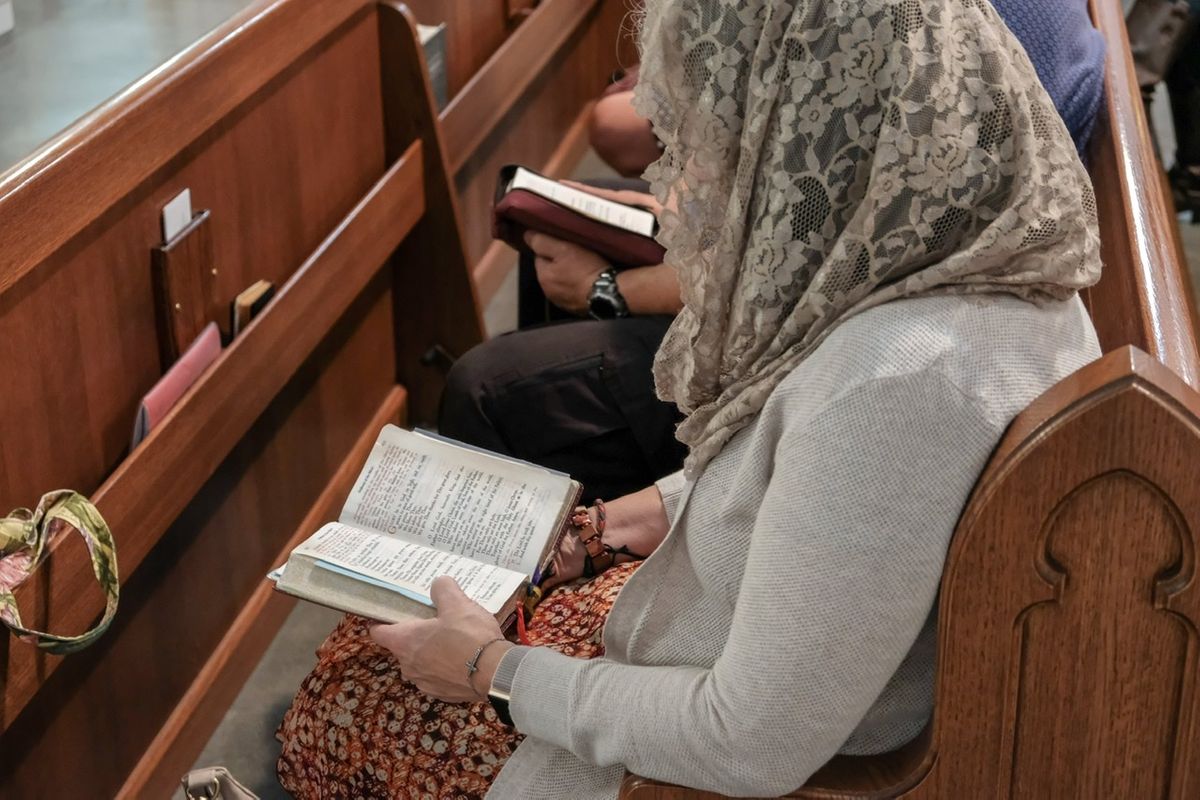 Woman Reading Missal at Latin Mass - Catholic Stock Photo