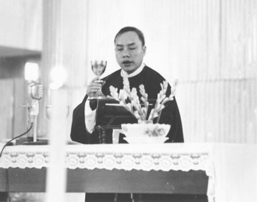 Vietnamese Catholic Priest Celebrating Communion - Catholic Stock Photo