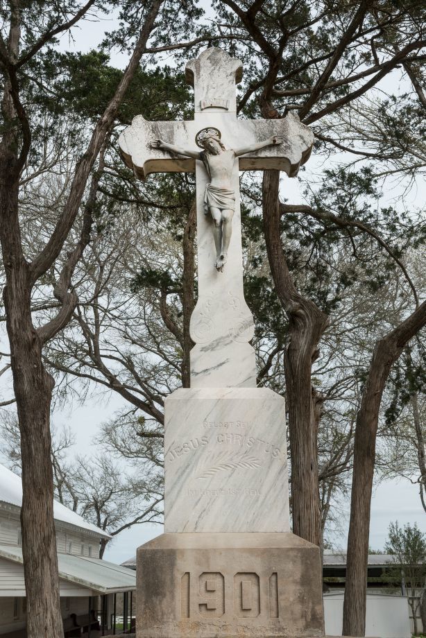 Statue of Jesus on the Cross outside St. Mary Catholic Church, Texas - Catholic Stock Photo