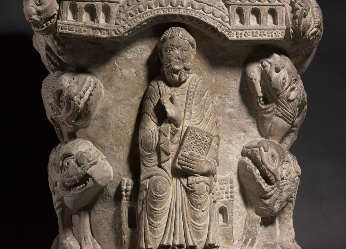 Daniel in the Lion's Den Sculpture (12th Century, France) - Catholic Stock Photo