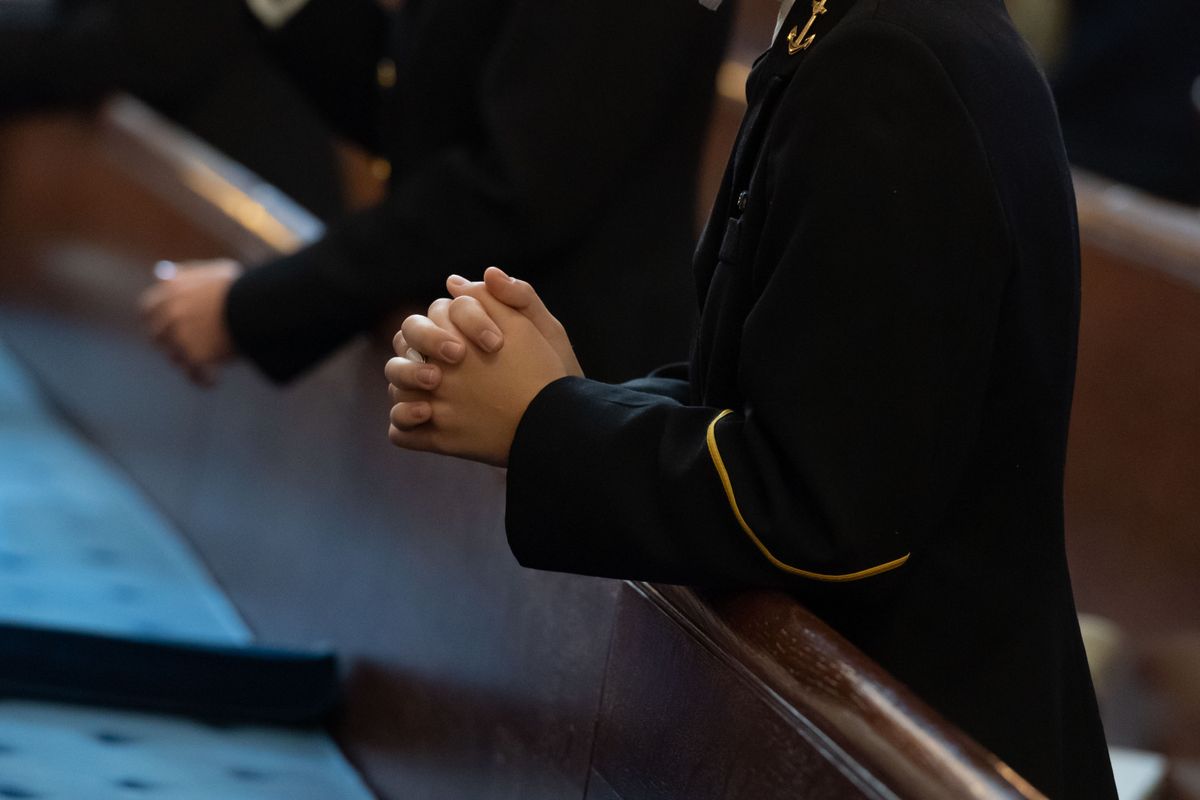 People Praying at Naval Academy Catholic Mass - Catholic Stock Photo