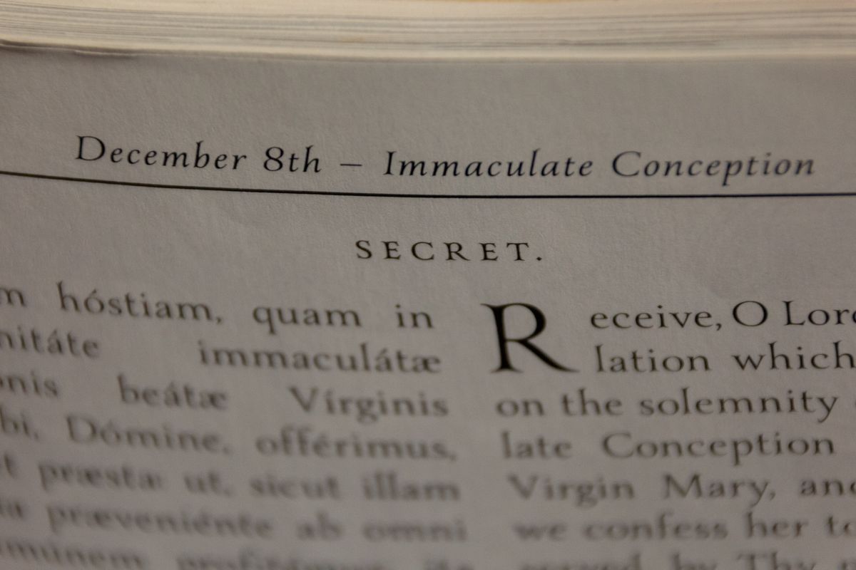 Latin Mass Missal Open to Immaculate Conception - Catholic Stock Photo