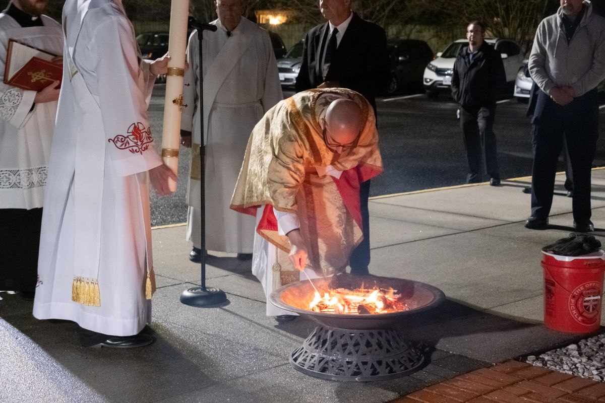 Priest Blessing Easter Fire at the Easter Vigil 2023 (Holy Spirit Catholic Church, Virginia Beach, Virginia, United States) - Catholic Stock Photo