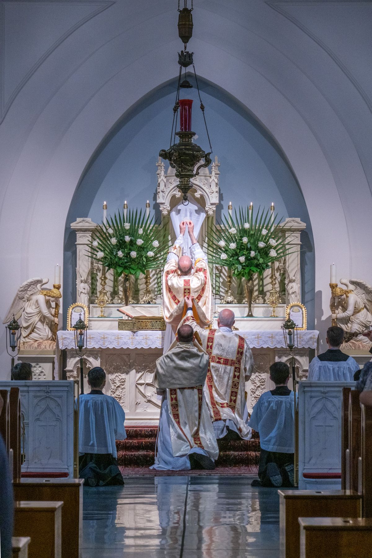 Consecration and Elevation on Holy Thursday, Latin Mass, 2023 (Saint Benedict's Parish, Chesapeake, Virginia, United States) - Catholic Stock Photo