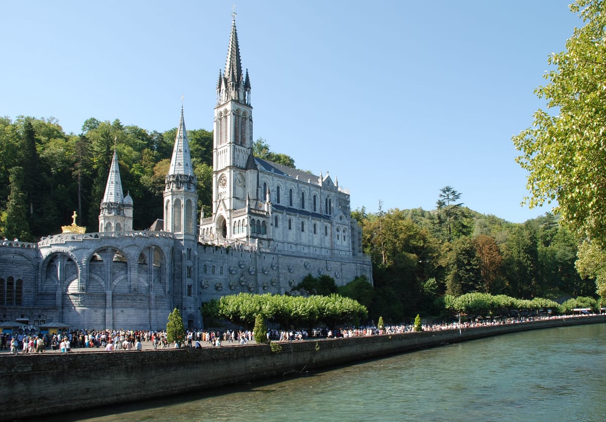 The Sanctuary Basilica built at Lourdes directly above the Grotto of the Apparitions (2009, France) - Catholic Stock Photo