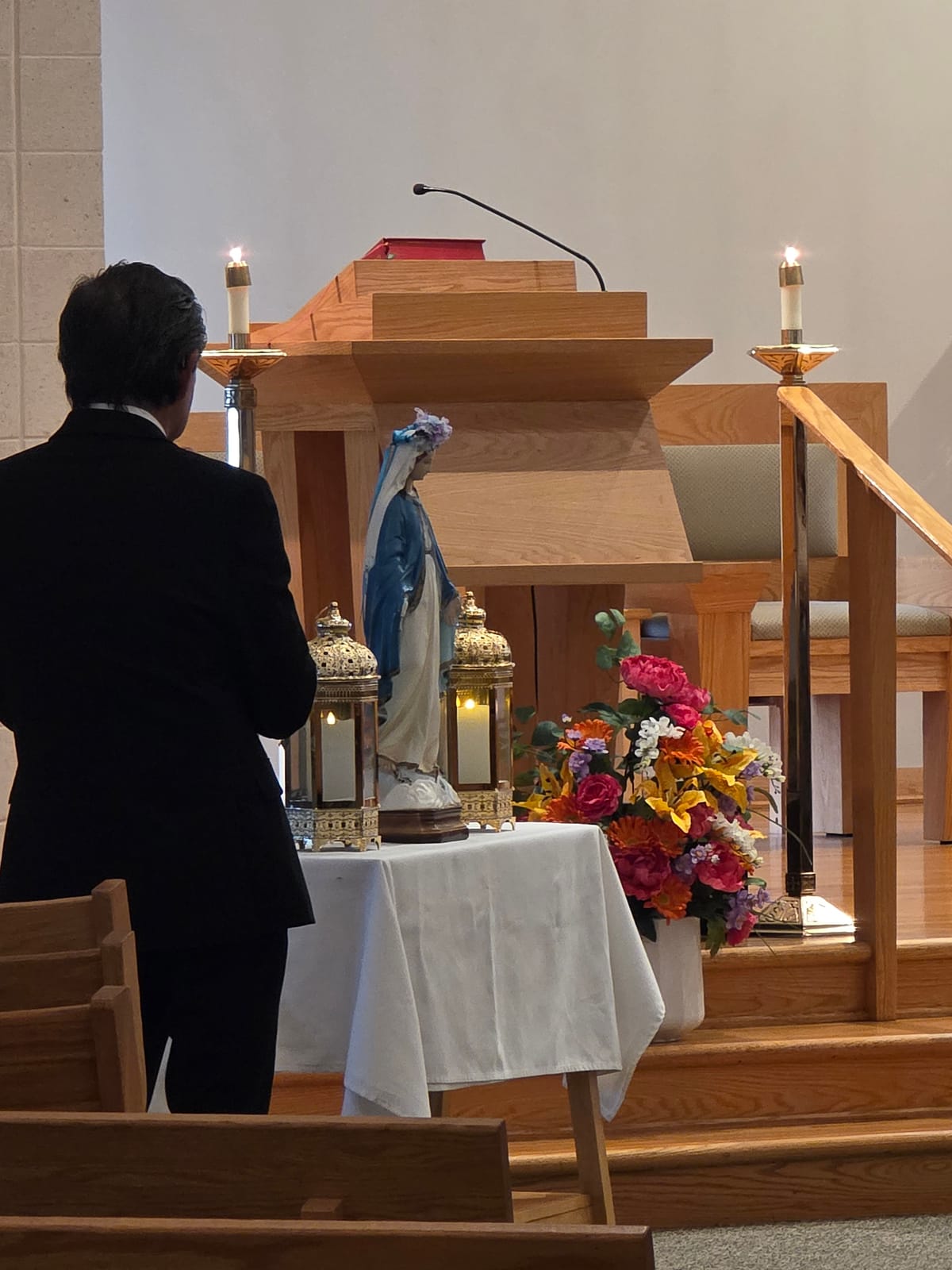 Virgin Mary Statue and Candles during Mass (2026) by Shalone Cason - Public Domain Catholic Stock Photo