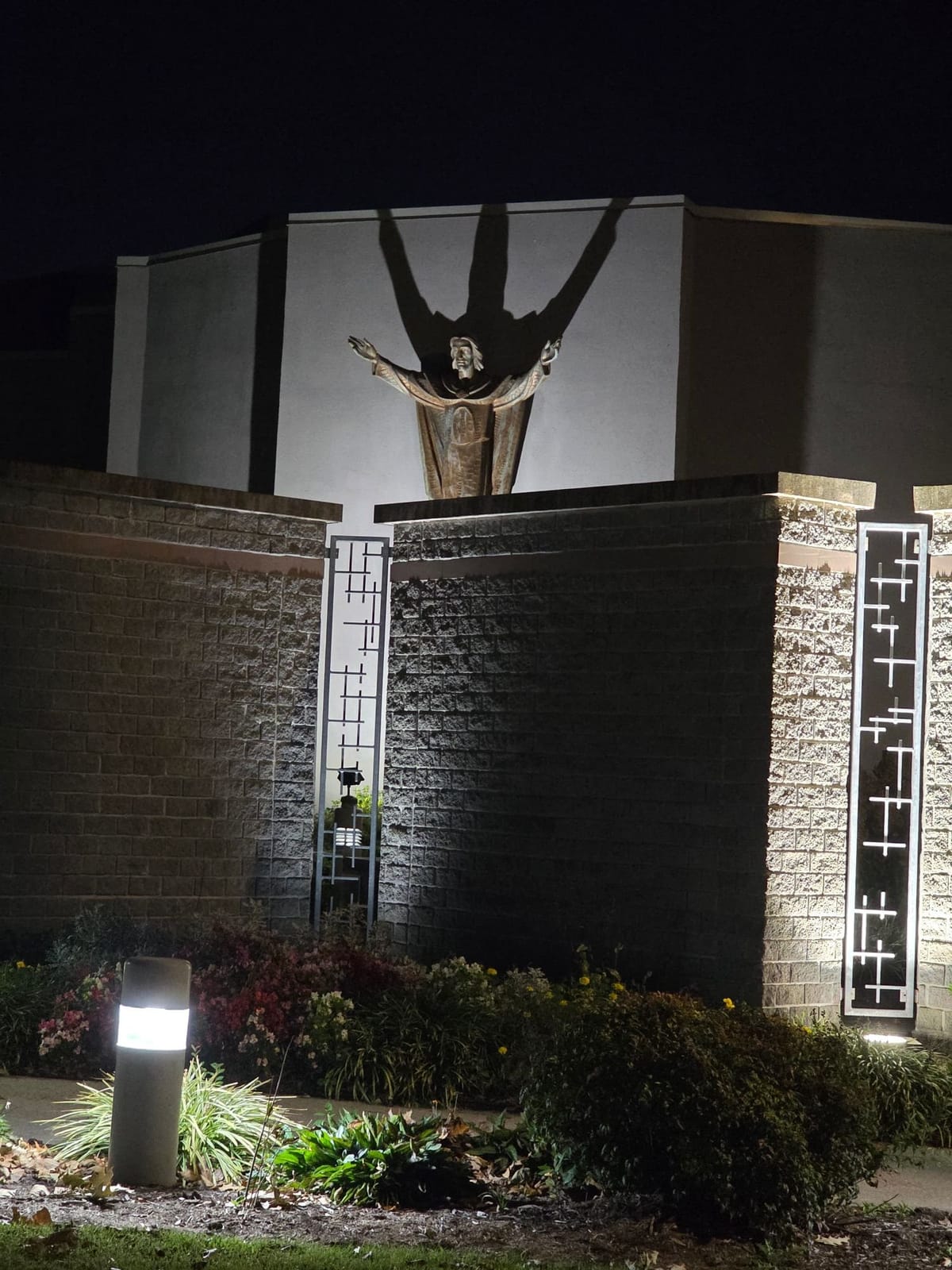 Christ Statue with Outstretched Arms and Shadow at Night, Church of the Ascension, Virginia Beach (2026) by Shalone Cason - Public Domain Catholic Stock Photo