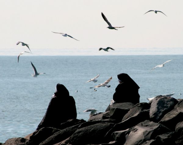 Nuns near the Ocean - Catholic Stock Photo