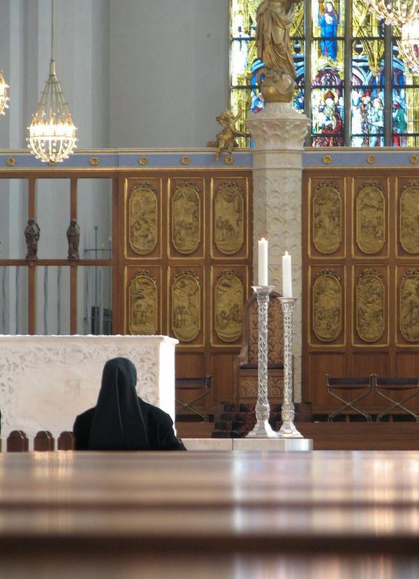 Nun Sitting in a Church, Germany - Catholic Stock Photo