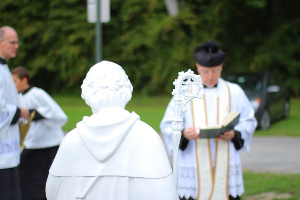 FSSP Priests Blessing a Statue - Catholic Stock Photo